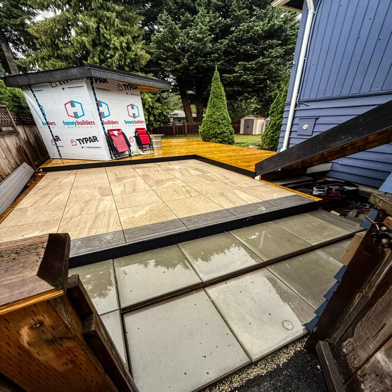 2cm porcelain patio tied into a new cedar deck